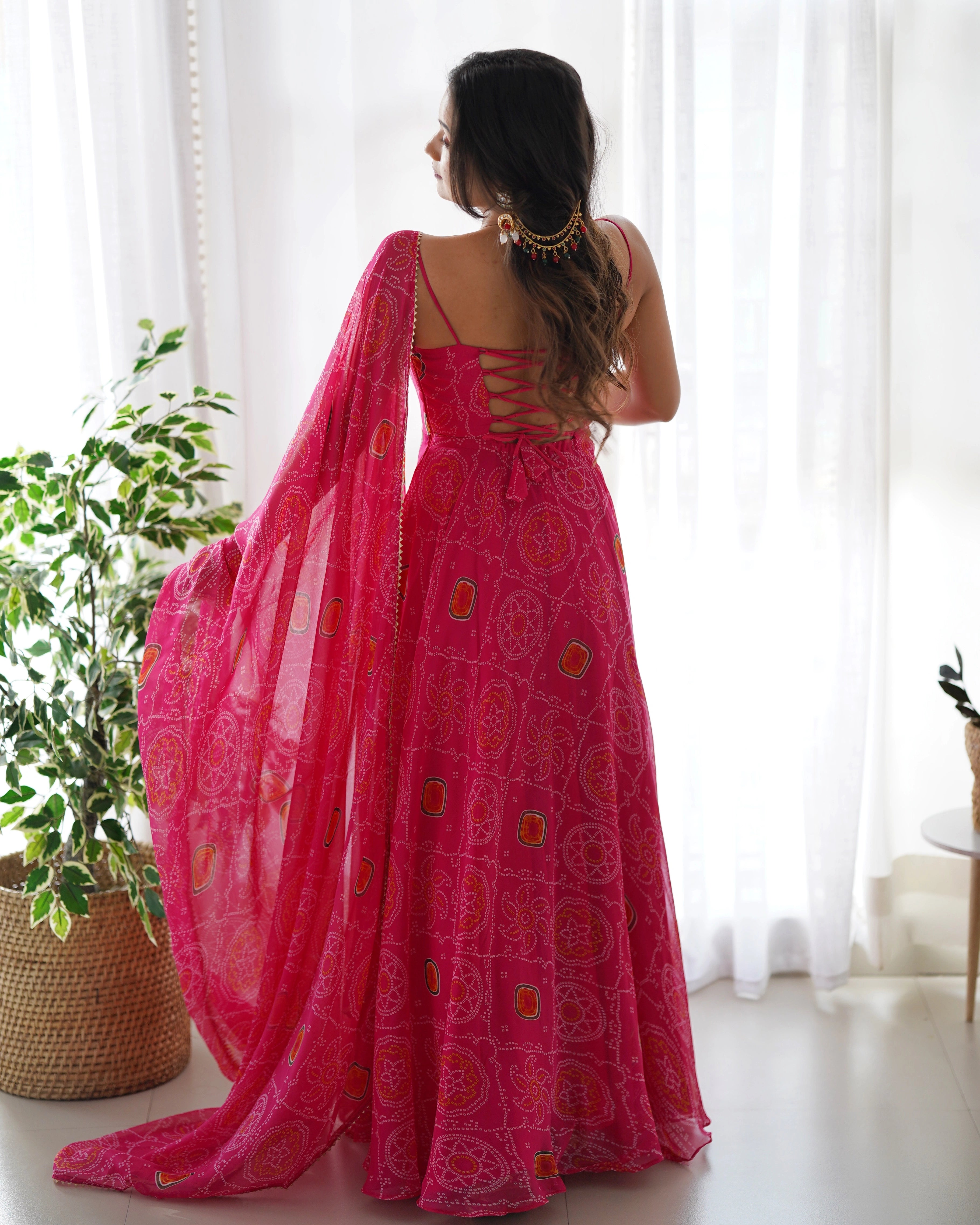 Vibrant Pink Chiffon Bandhej Gown with Intricate Triangle Lace Dupatta