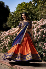 Vibrant Orange and Navy Blue Kanchipuram Silk Lehenga Choli with Lace Border Dupatta