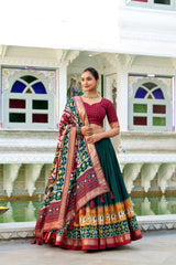 Green Tussar Silk Traditional Lehenga Choli with Heavy Tassels and Canvas Stitching