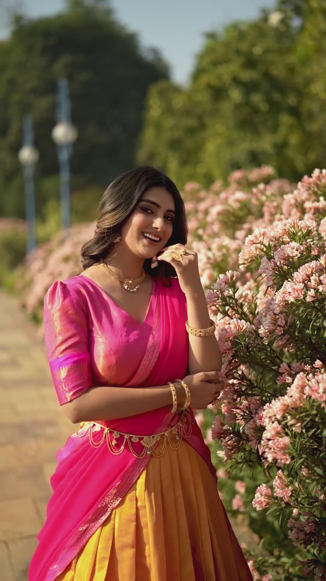 Vibrant Yellow and Pink Kanchipuram Silk Lehenga Choli with Golden Border and Zari Weaving